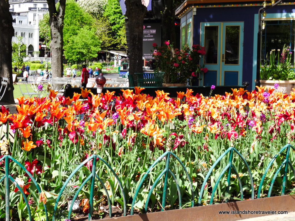 Colorful flowers in shades of yellows, oranges, reds, purples, and pinks at Tivoli Gardens